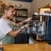Barista at Work Skillfully Crafting the Perfect Coffee Experience in a Warm, Cozy Cafe