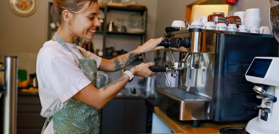 Barista at Work Skillfully Crafting the Perfect Coffee Experience in a Warm, Cozy Cafe