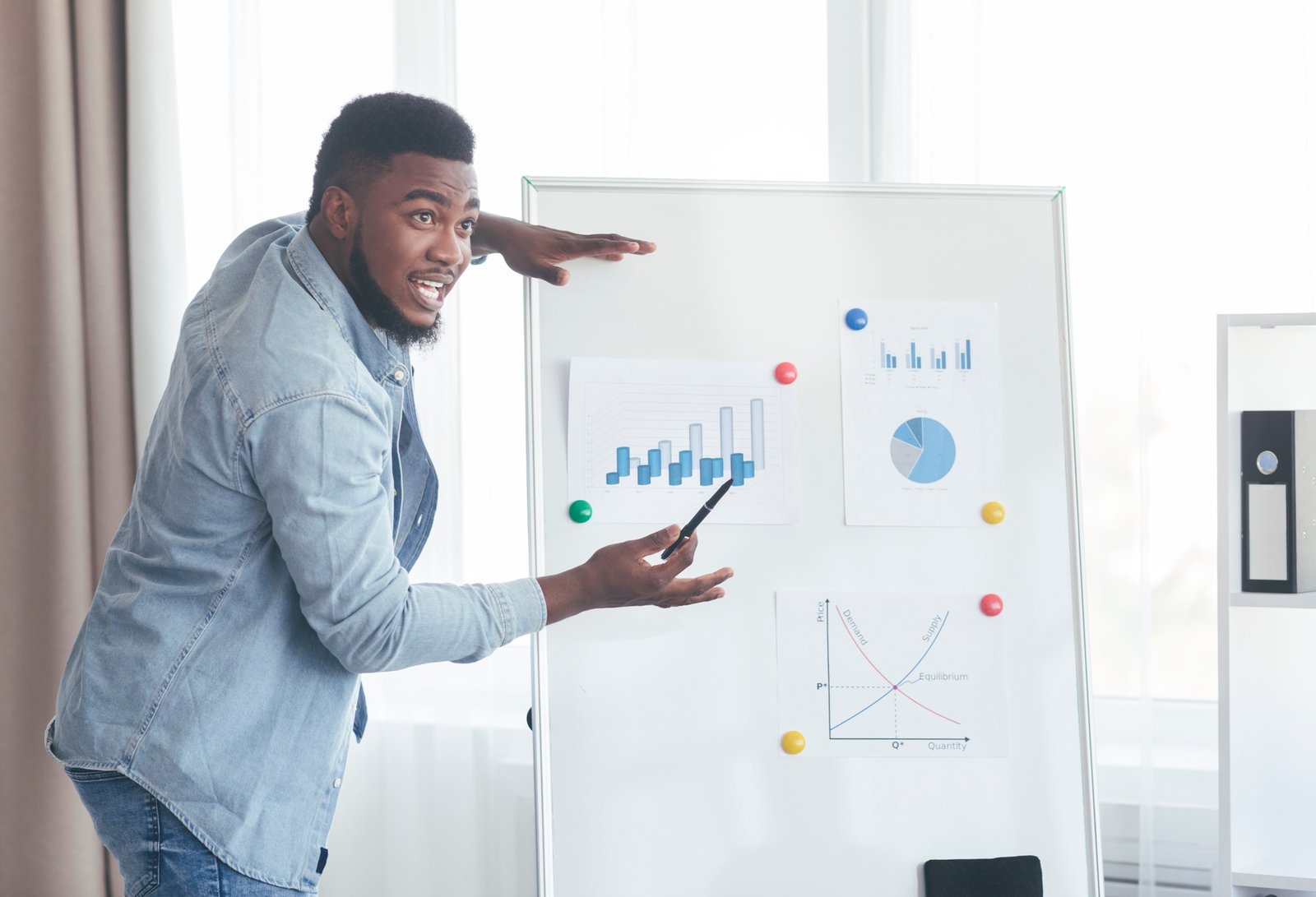 Confident top manager presenting company development plan to colleagues